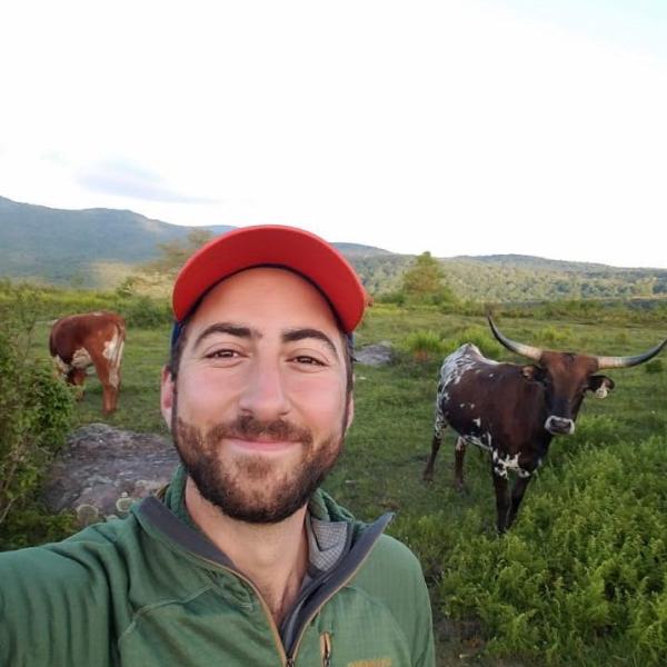 Matt Haines posing in a green field