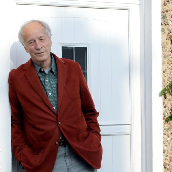 Richard Ford leaning against a doorway