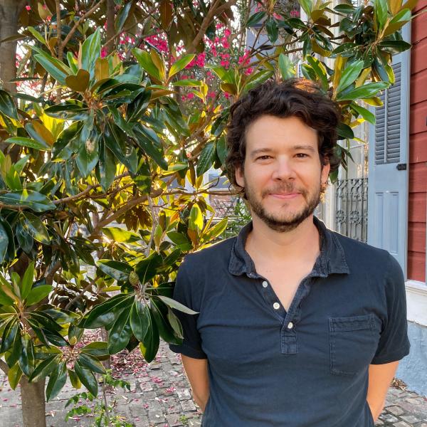 Rien Fertel standing outside in front of greenery