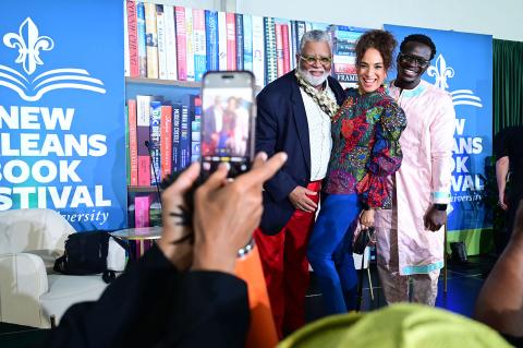 Alexander Smalls, Michelle Miller and Serigne Mbaye share a joyful moment on stage at the 2025 New Orleans Book Festival at Tulane University. (Photo by Cheryl Gerber) 