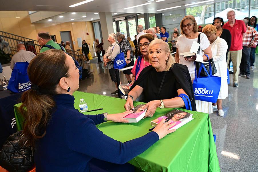 Attendees at a book signing for the 2024 New Orleans Book Festival